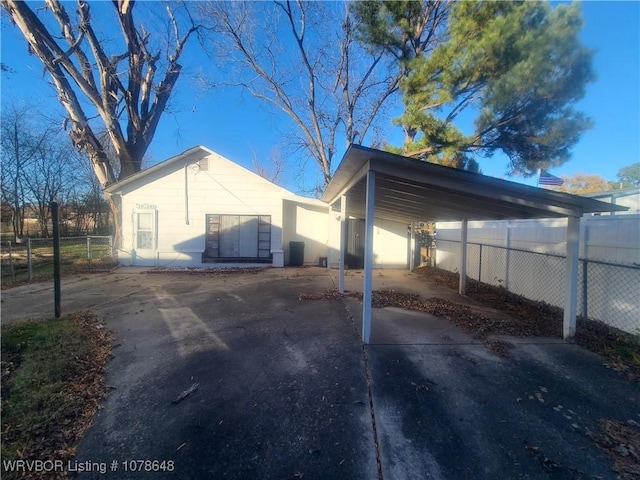 view of property exterior with a carport