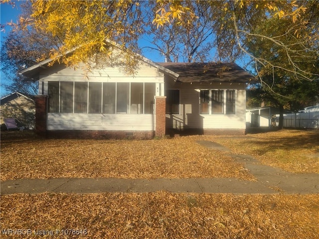 view of front facade featuring a sunroom