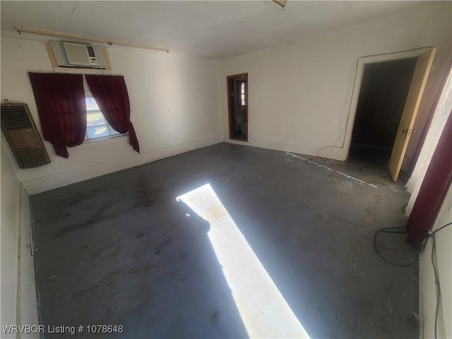 garage with heating unit and a wall mounted AC