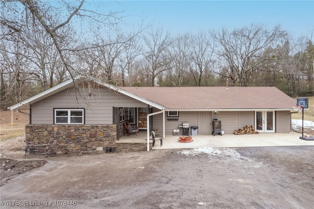 back of house with french doors and a patio area