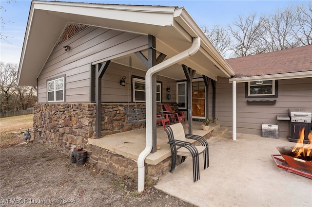 exterior space featuring area for grilling and an outdoor fire pit