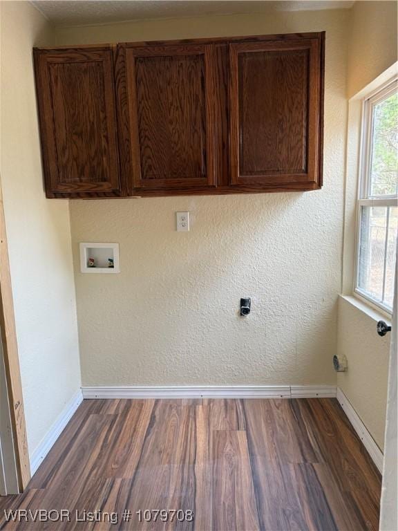 710 S Mulberry St, Sallisaw, OK 74955 - laundry area featuring dark wood-style floors, cabinet space, hookup for a washing machine, and baseboards