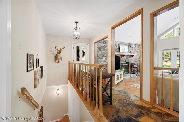 517 Ross Hampton Rd, Hackett, AR 72937 - staircase featuring a chandelier and wood finished floors