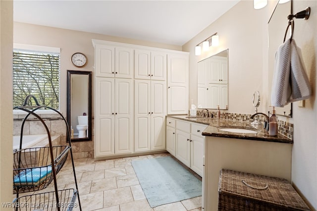 517 Ross Hampton Rd, Hackett, AR 72937 - bathroom featuring double vanity, a sink, and toilet