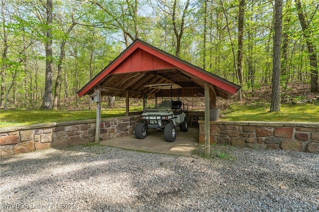 517 Ross Hampton Rd, Hackett, AR 72937 - view of vehicle parking featuring a view of trees, driveway, and a detached carport