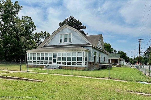 back of property featuring a yard