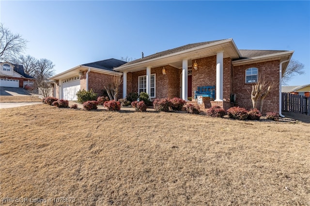 single story home featuring a garage and a front yard