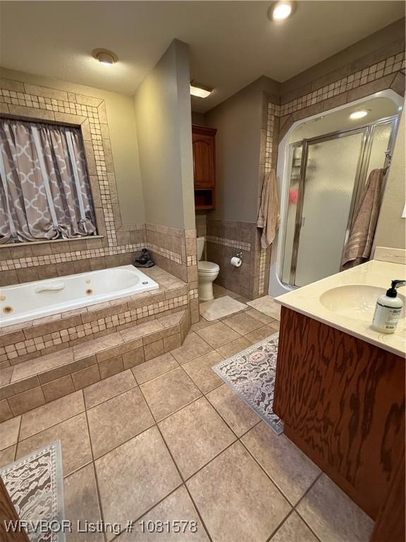 417 N Rattlesnake Rd, Charleston, AR 72933 - full bathroom with tile patterned floors, a tub with jets, vanity, and a shower stall