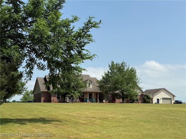 417 N Rattlesnake Rd, Charleston, AR 72933 - view of front of property featuring a front yard, brick siding, and a garage