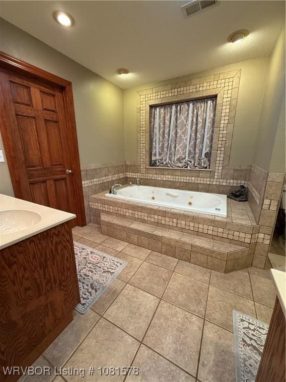 417 N Rattlesnake Rd, Charleston, AR 72933 - bathroom featuring vanity, a whirlpool tub, and tile patterned floors