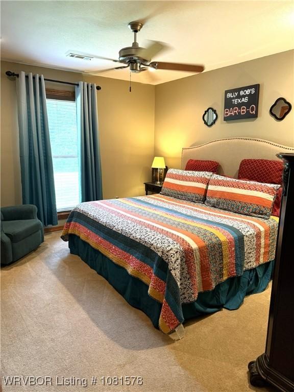 417 N Rattlesnake Rd, Charleston, AR 72933 - carpeted bedroom featuring a ceiling fan