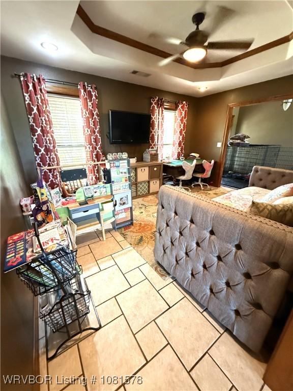 417 N Rattlesnake Rd, Charleston, AR 72933 - tiled living area with a tray ceiling and ceiling fan