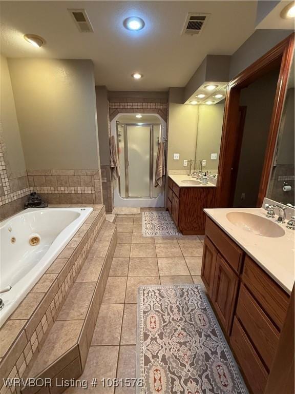 417 N Rattlesnake Rd, Charleston, AR 72933 - full bath featuring a tub with jets, a stall shower, two vanities, tile patterned floors, and recessed lighting