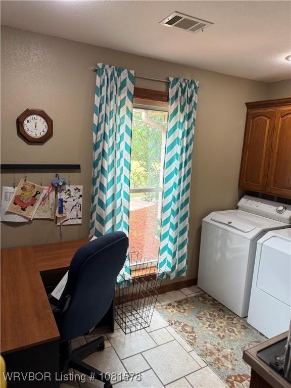 417 N Rattlesnake Rd, Charleston, AR 72933 - washroom with washer and dryer, a desk, cabinet space, and light tile patterned flooring