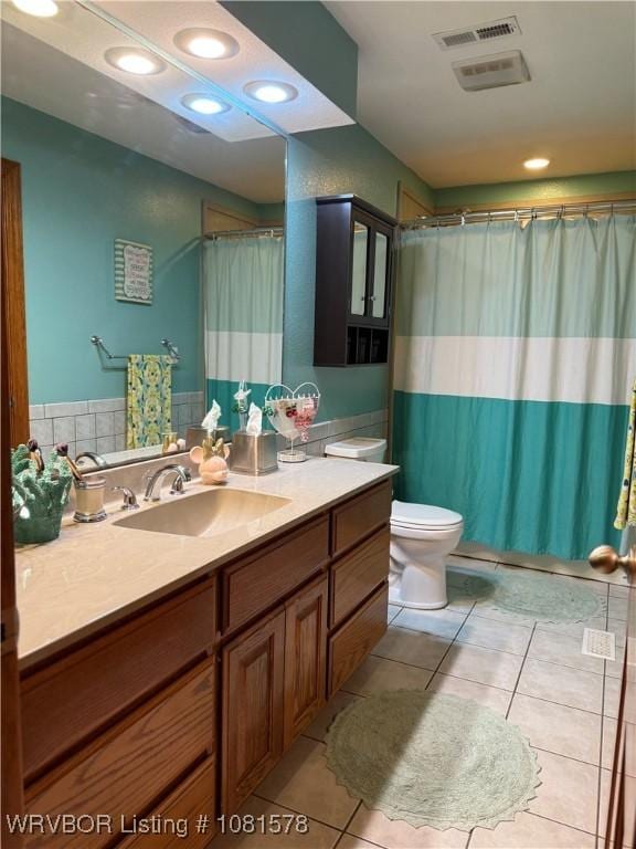 417 N Rattlesnake Rd, Charleston, AR 72933 - full bath with vanity, tile patterned flooring, a shower with shower curtain, recessed lighting, and a wainscoted wall
