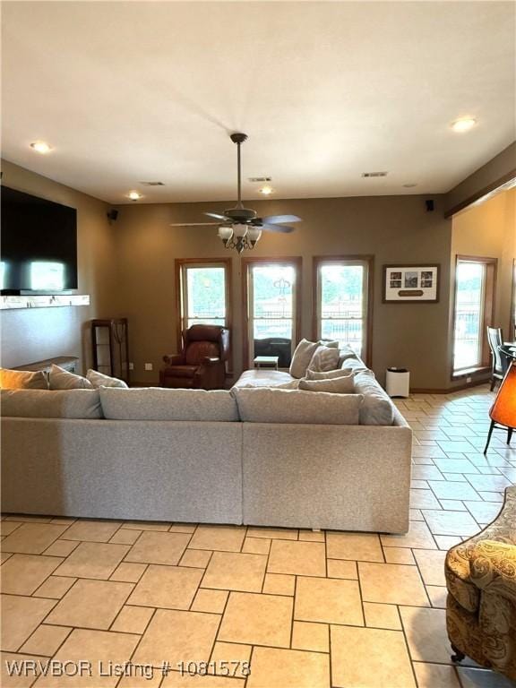 417 N Rattlesnake Rd, Charleston, AR 72933 - living room with healthy amount of natural light, a ceiling fan, and recessed lighting