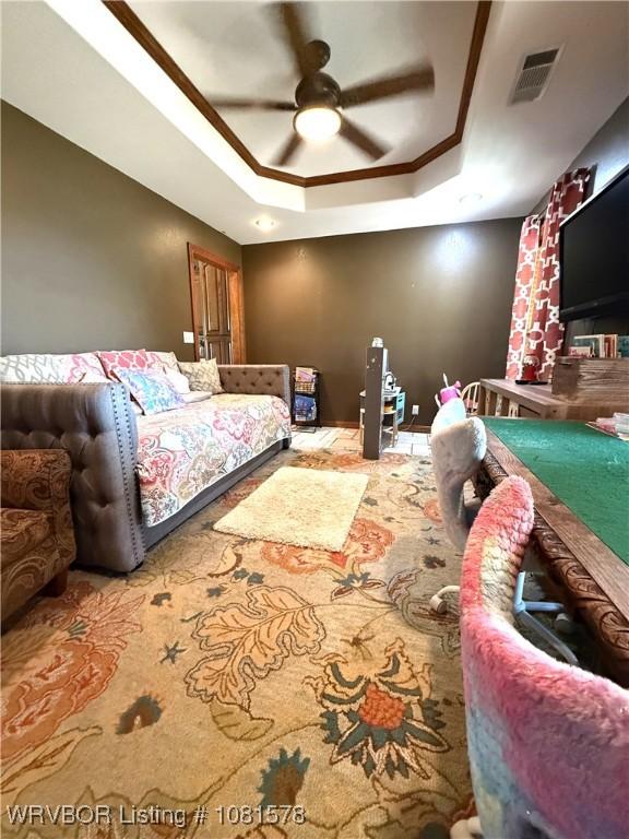 417 N Rattlesnake Rd, Charleston, AR 72933 - bedroom featuring a tray ceiling and a ceiling fan