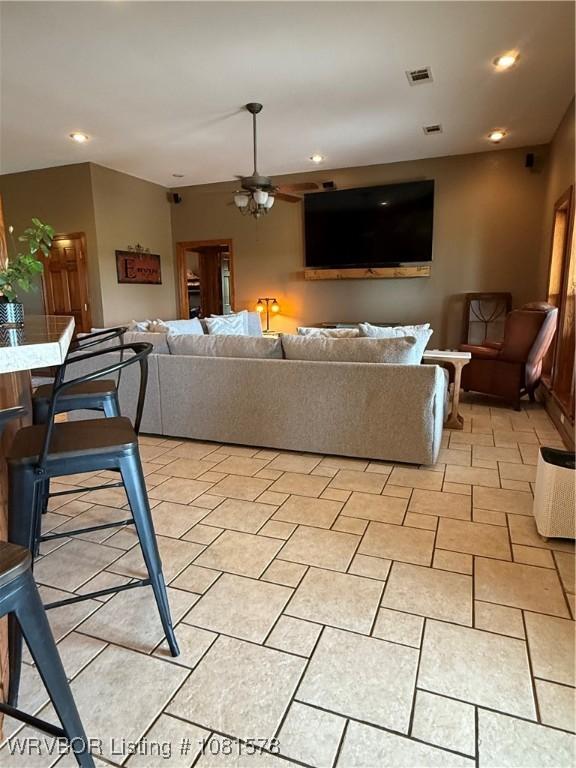 417 N Rattlesnake Rd, Charleston, AR 72933 - living room with ceiling fan, recessed lighting, and light tile patterned floors