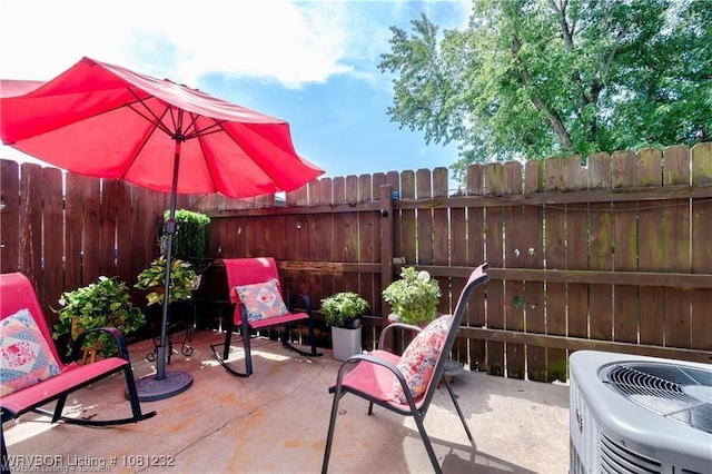 108 Wilson Ave, Poteau, OK 74953 - fenced backyard featuring a patio and central AC unit
