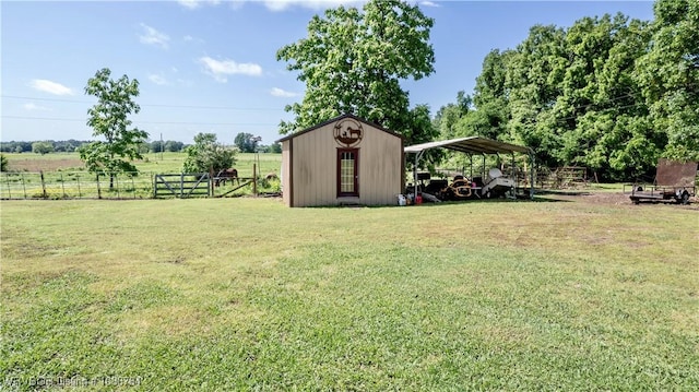 view of yard featuring fence and a carport