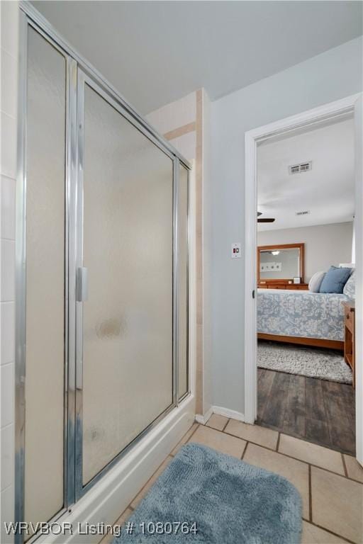 full bath with a shower stall, tile patterned flooring, ensuite bathroom, and visible vents