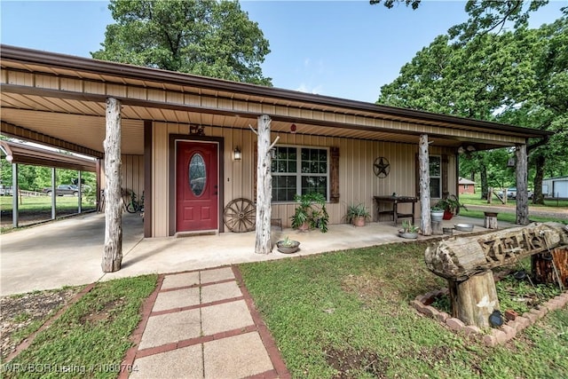 view of front of home featuring a porch and an attached carport
