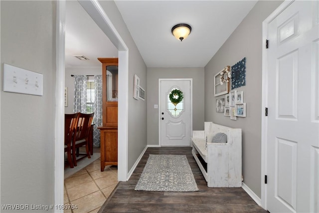 entrance foyer featuring baseboards and visible vents