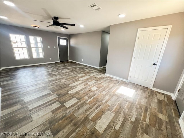 interior space with baseboards, visible vents, ceiling fan, wood finished floors, and recessed lighting