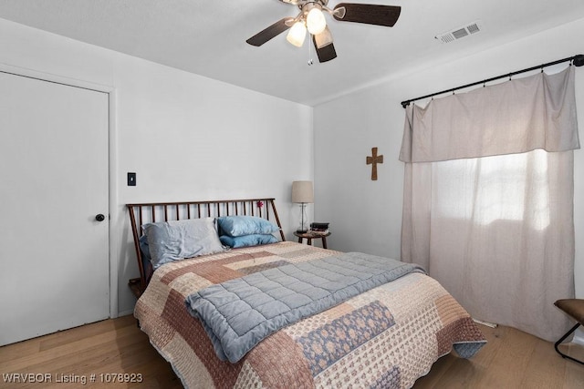 bedroom featuring ceiling fan and hardwood / wood-style floors