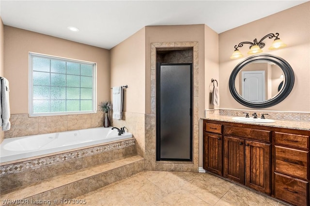 bathroom with separate shower and tub and vanity