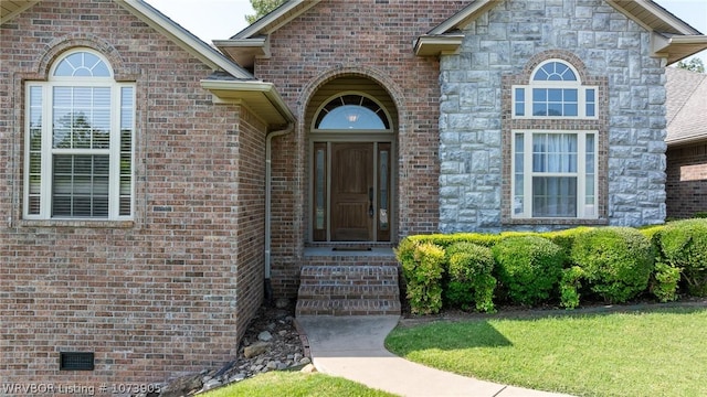 entrance to property with a yard