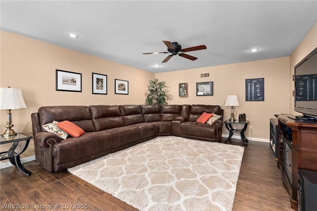 living room featuring dark hardwood / wood-style floors and ceiling fan