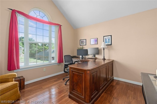 office featuring wood-type flooring, vaulted ceiling, and a wealth of natural light