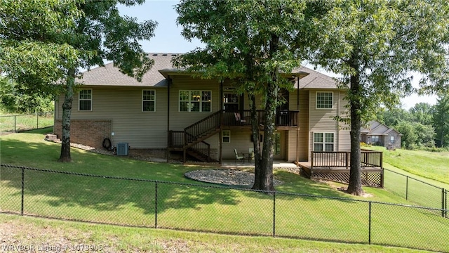 view of front facade with a wooden deck, a front lawn, and central AC unit