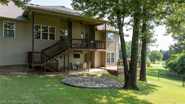 back of house featuring a yard and a patio