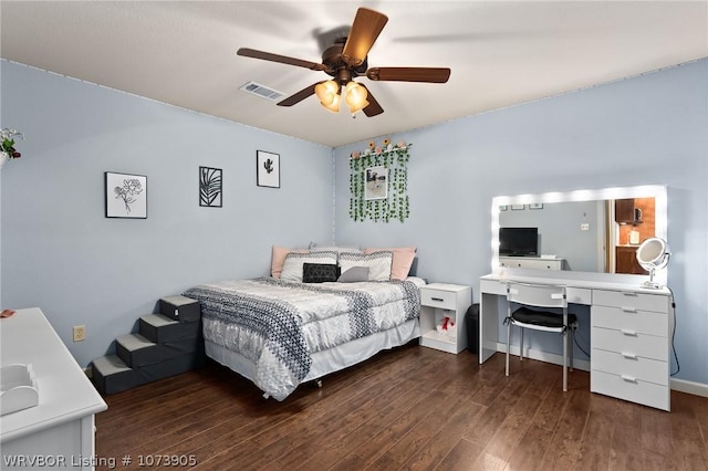 bedroom featuring ceiling fan and dark wood-type flooring