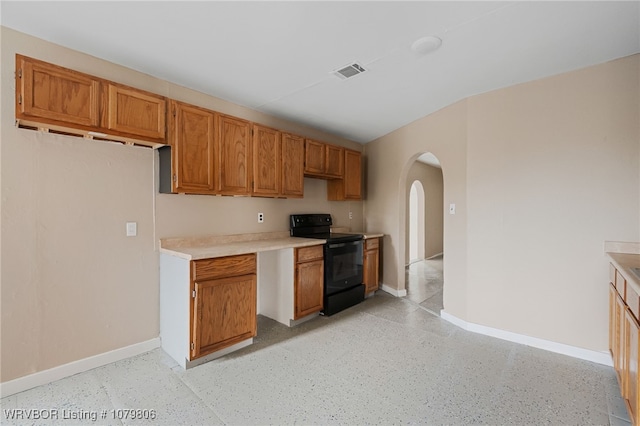475616 E 1060th Rd, Muldrow, OK 74948 - kitchen featuring light countertops, arched walkways, baseboards, visible vents, and electric range