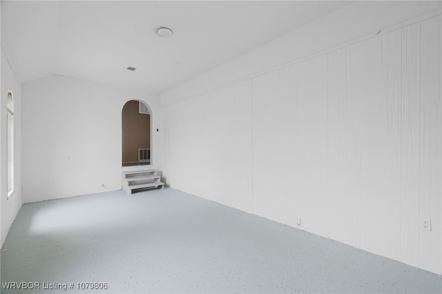 475616 E 1060th Rd, Muldrow, OK 74948 - spare room with visible vents, arched walkways, and vaulted ceiling