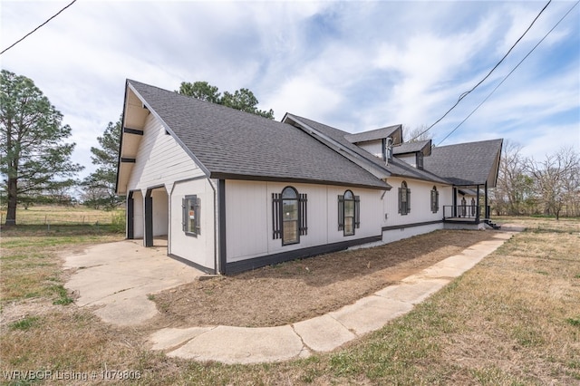 475616 E 1060th Rd, Muldrow, OK 74948 - view of property exterior with a garage, driveway, and a shingled roof