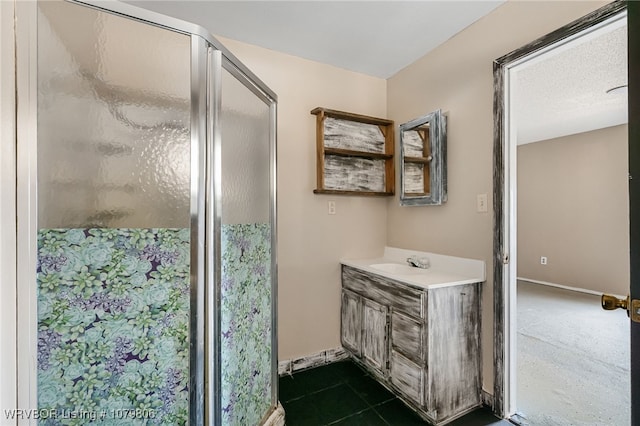475616 E 1060th Rd, Muldrow, OK 74948 - full bath with a shower stall, baseboards, vanity, and a textured ceiling