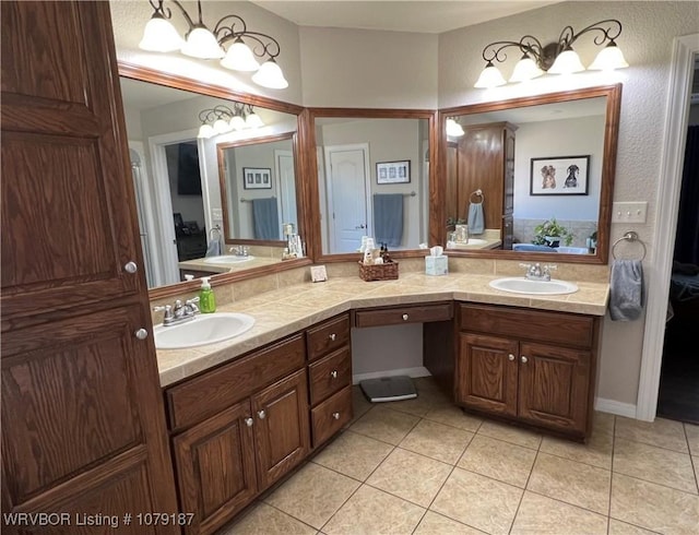 bathroom with double vanity, a sink, and tile patterned floors