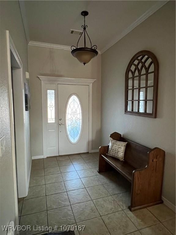 entrance foyer featuring visible vents, crown molding, baseboards, and light tile patterned floors