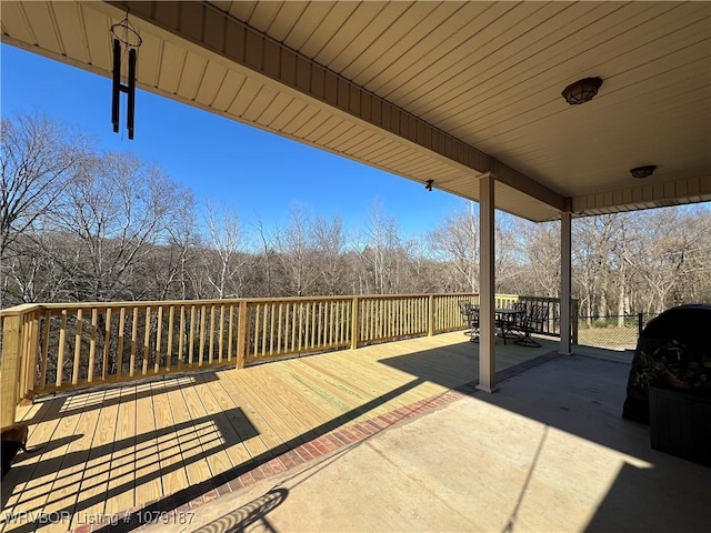 view of patio / terrace featuring a deck and outdoor dining space