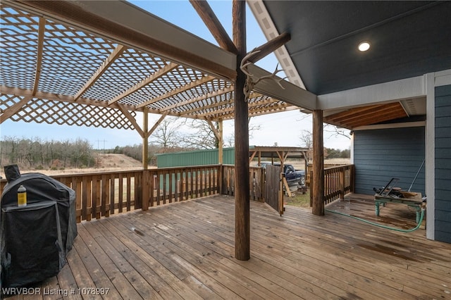 wooden deck featuring area for grilling