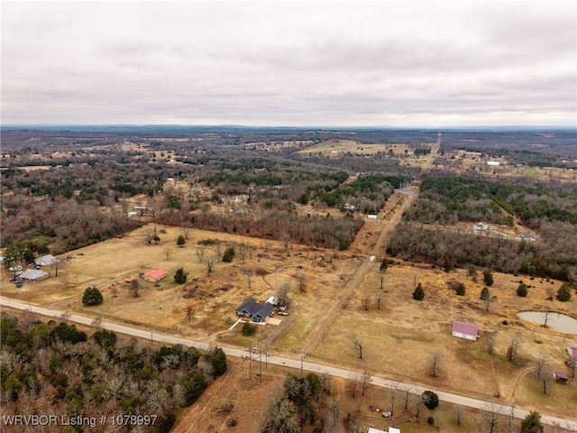 birds eye view of property featuring a rural view