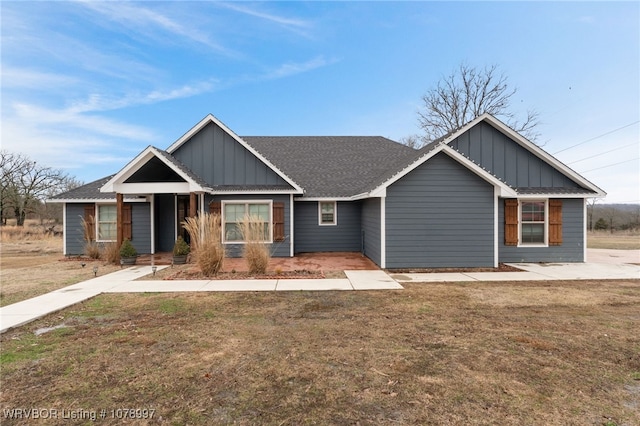 craftsman-style home with a front yard