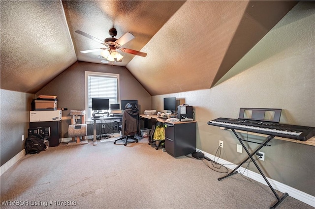 carpeted office space featuring ceiling fan, vaulted ceiling, and a textured ceiling