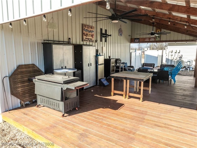 wooden deck featuring ceiling fan