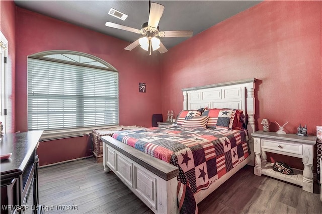 bedroom with hardwood / wood-style flooring and ceiling fan