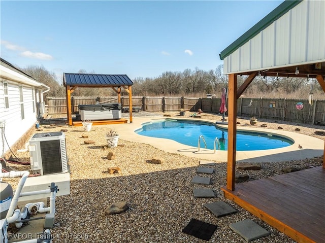 view of pool featuring a gazebo, central AC unit, a hot tub, and a deck